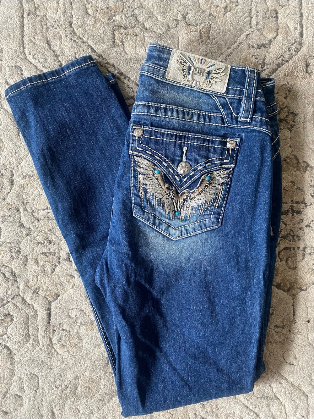 Miss Me Dark Blue Mid Rise Skinny Jeans w/ Turquoise Accents. Size 28, inseam 30